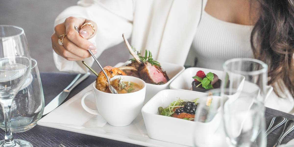 food sampler on a formal table setting